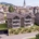Visualisierung Haus 2 der Überbauung Kalkofen in Oberegg, im Hintergrund das Dorf mit Kirche